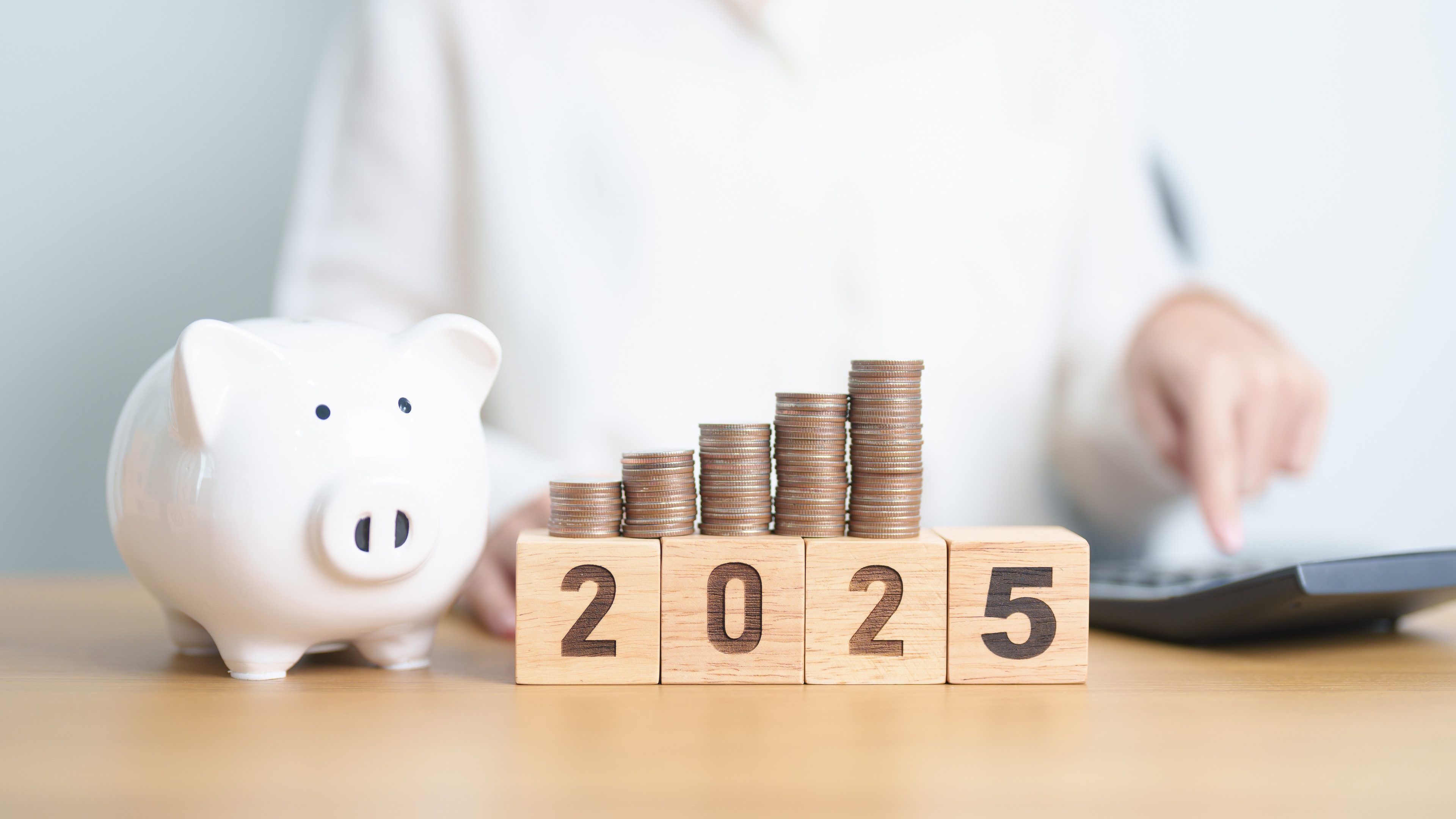 Happy New Year 2025 with piggy bank. Resolution, Goals, Plan, Action, Money Saving, Retirement fund, Pension, Investment and Financial concepts