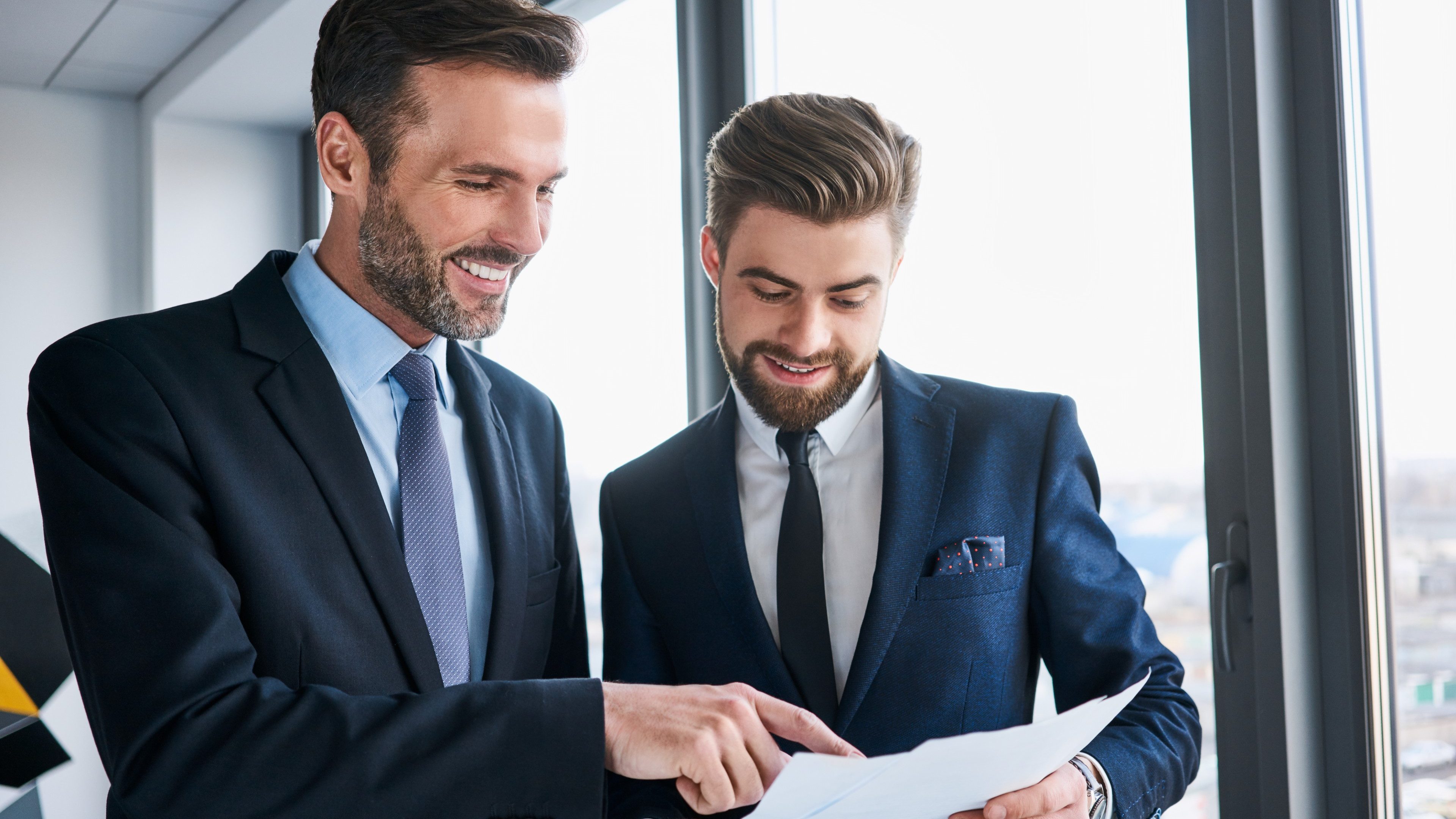 Two businessmen discussing at office during business meeting