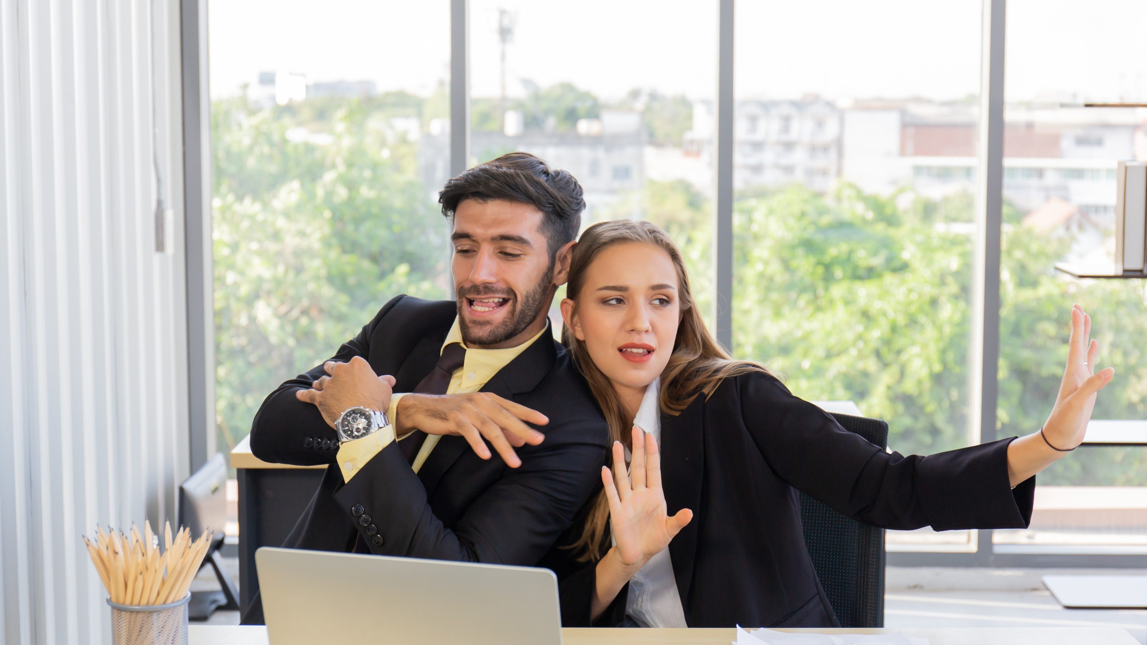 A new generation of business people who work at an office together with documents on the desk with smiles and happiness