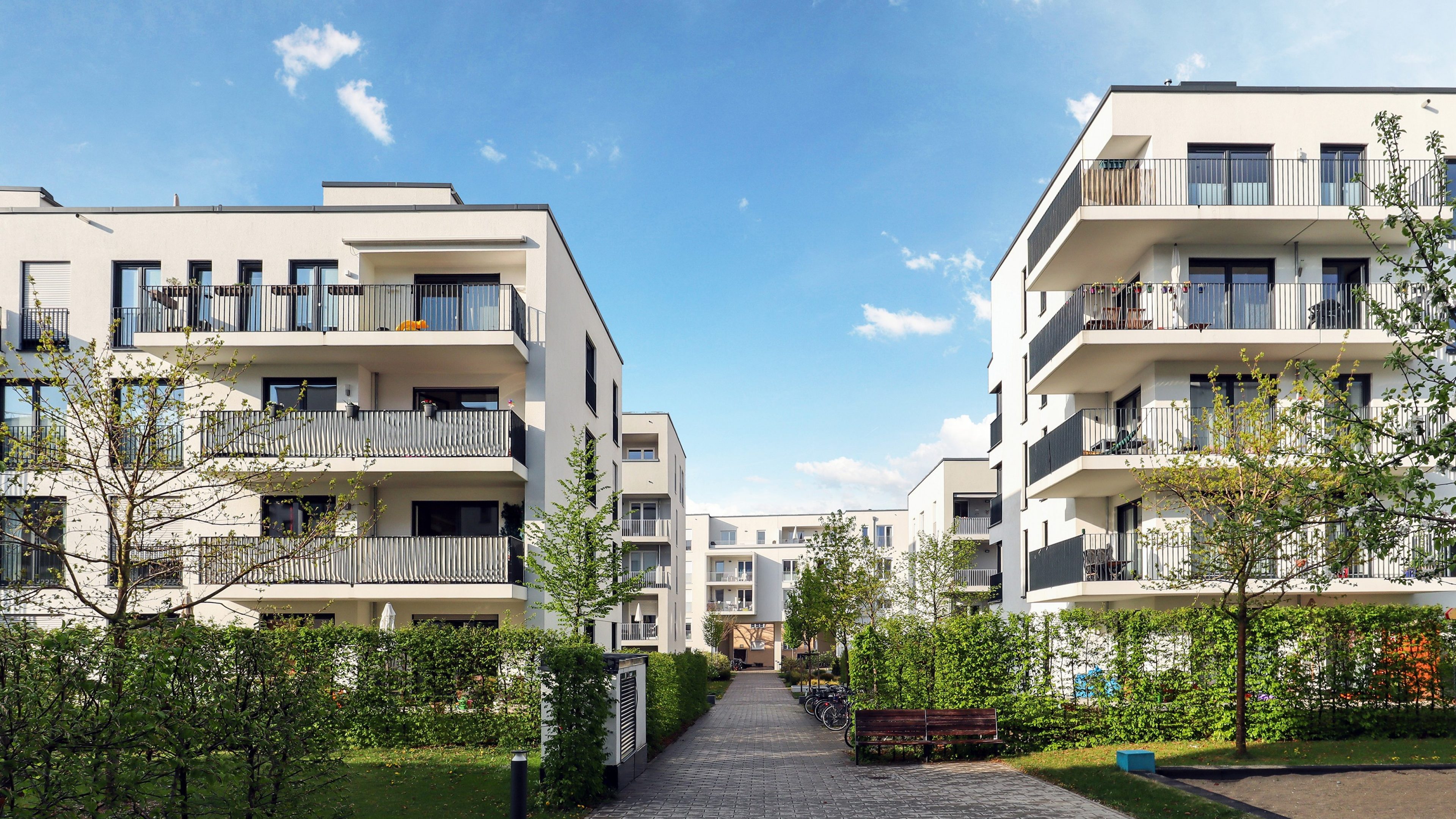 Cityscape of a residential area with modern apartment buildings, new green urban landscape in the city